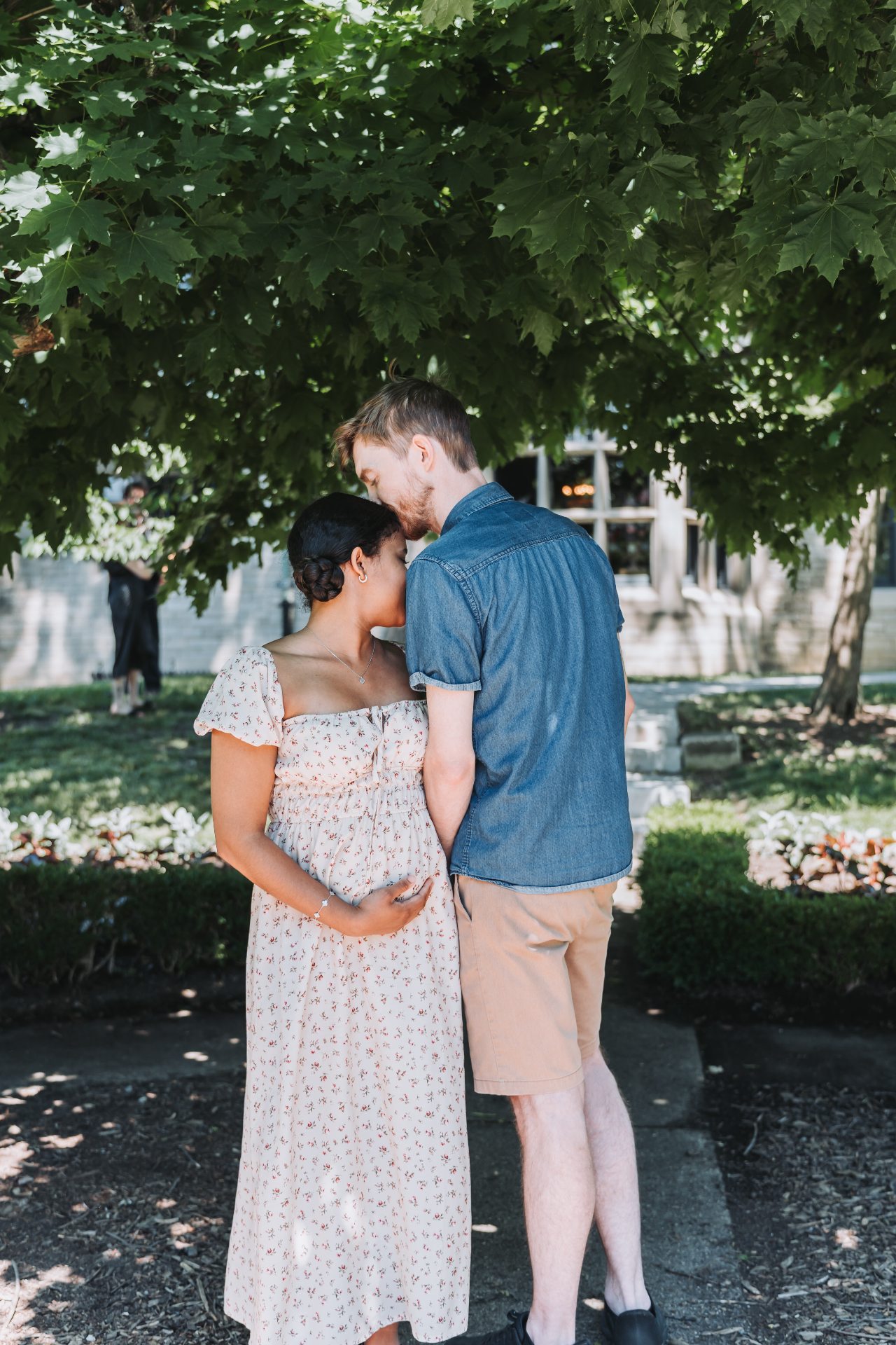 A kiss on the forehead under the maple tree